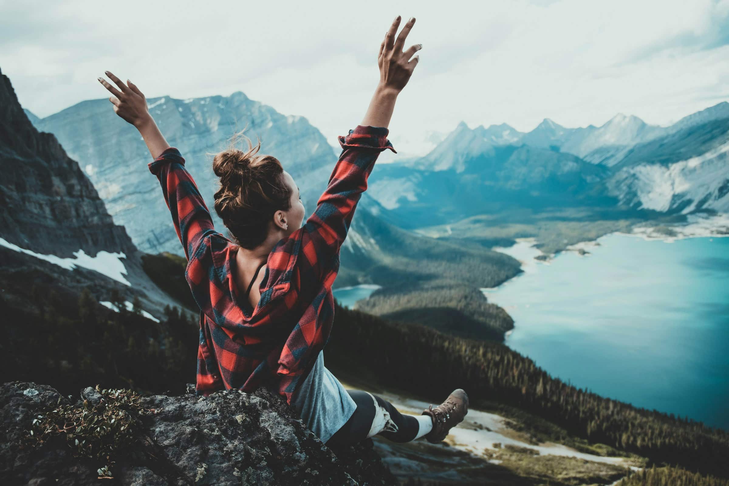 Man cheering in the mountains