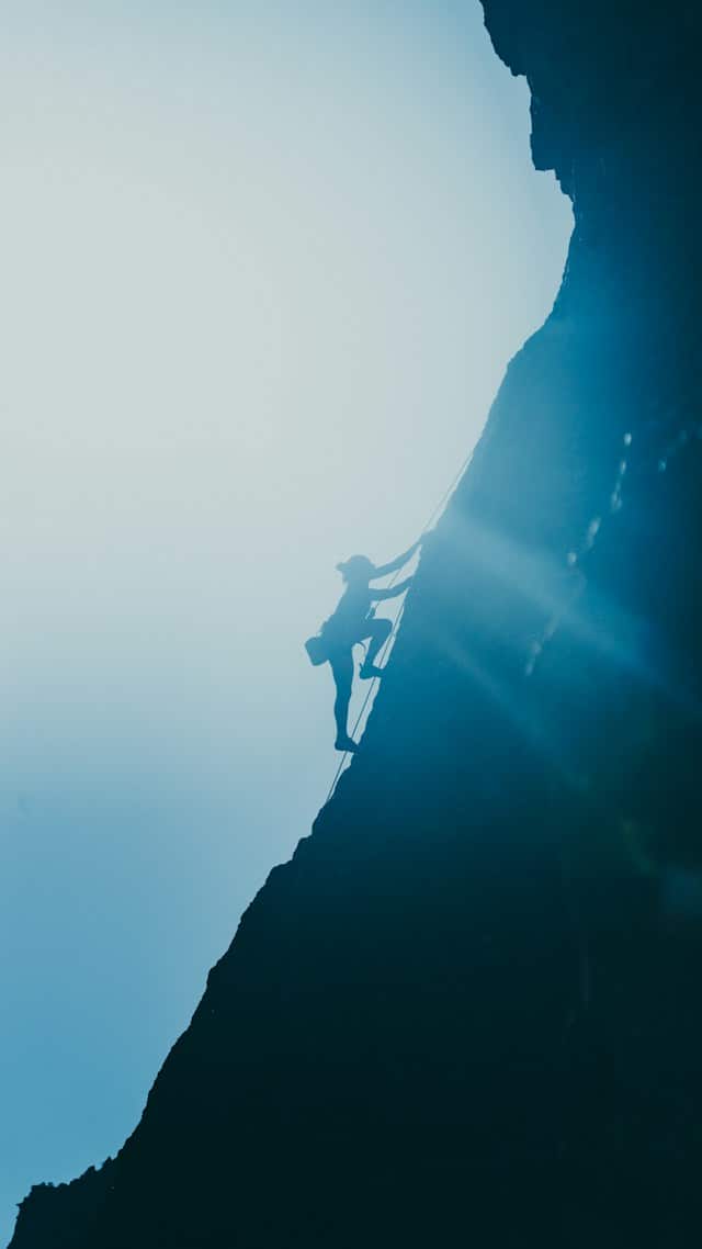 Mountain climber climbing in the mountains
