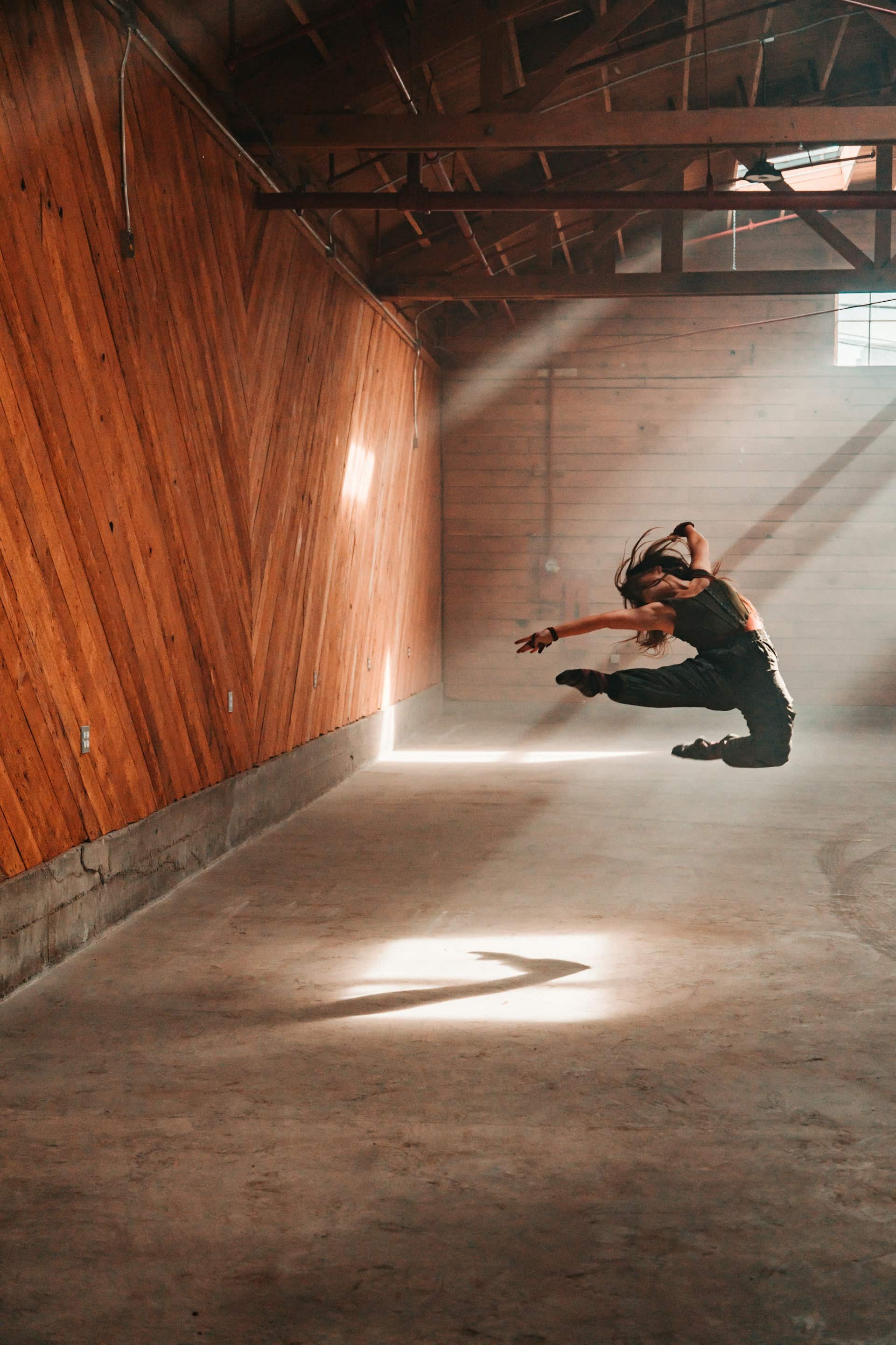 Woman dancing in a factory