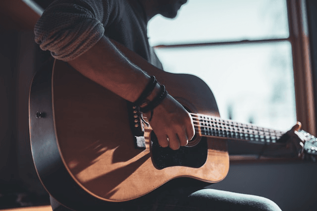 man playing guitar