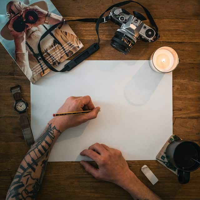 Man drawing on paper